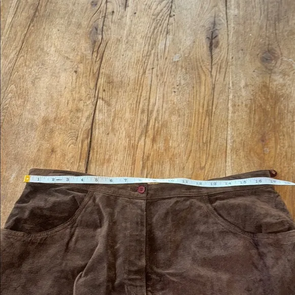 100% genuine leather, brown maxi skirt. Slit in the back. Size 16.