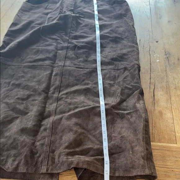 100% genuine leather, brown maxi skirt. Slit in the back. Size 16.