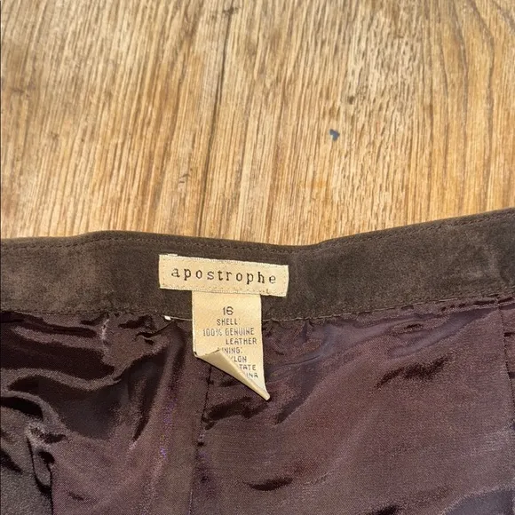 100% genuine leather, brown maxi skirt. Slit in the back. Size 16.