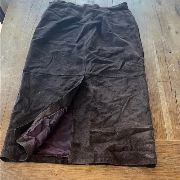 100% genuine leather, brown maxi skirt. Slit in the back. Size 16.