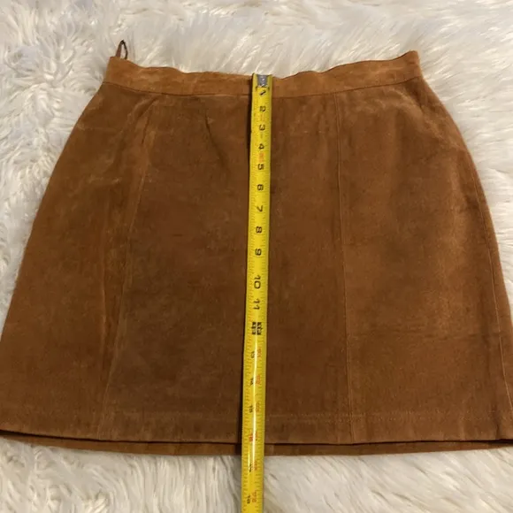 CLEAN LINES LEATHER MINI SKIRT LENGTH 16” WAIST 28/29” COLOR TAN ZIPPER BACK