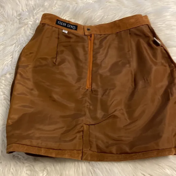 CLEAN LINES LEATHER MINI SKIRT LENGTH 16” WAIST 28/29” COLOR TAN ZIPPER BACK