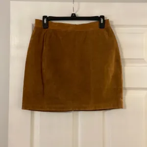 CLEAN LINES LEATHER MINI SKIRT LENGTH 16” WAIST 28/29” COLOR TAN ZIPPER BACK