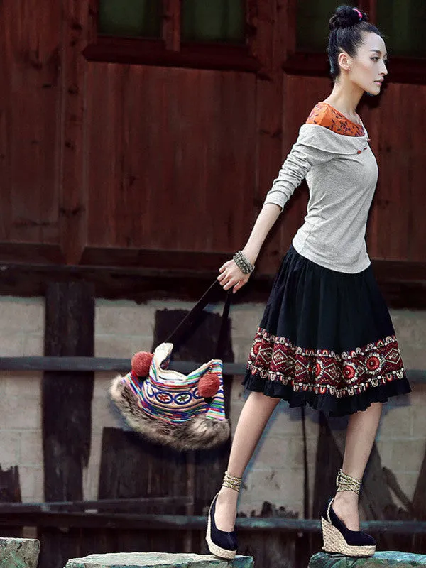 sloping embroidered shoulder top